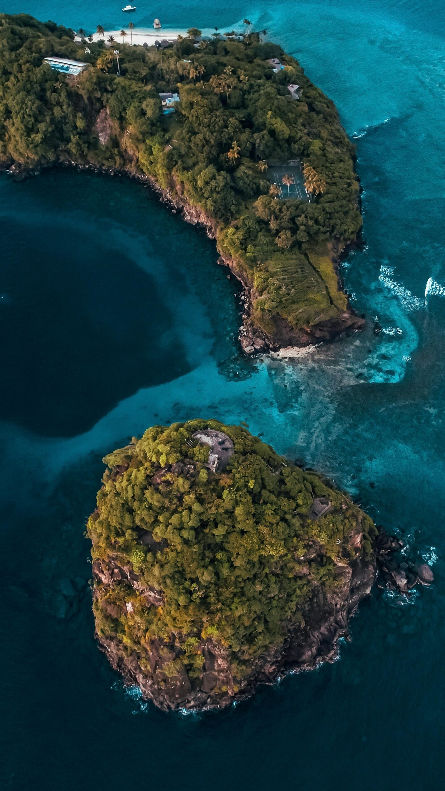 A breathtaking aerial view showcasing the lush greenery and turquoise waters of Saint Vincent and the Grenadines.