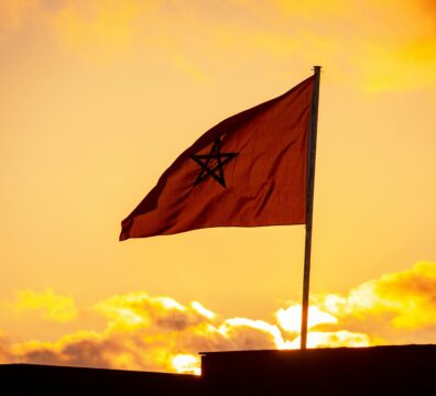 Morocco: AMMPS Launches Dedicated Email for Health Vigilance Activities (2026) Beautiful silhouette of Moroccan flag against vibrant sunset sky in Sidi Rahal, Morocco.