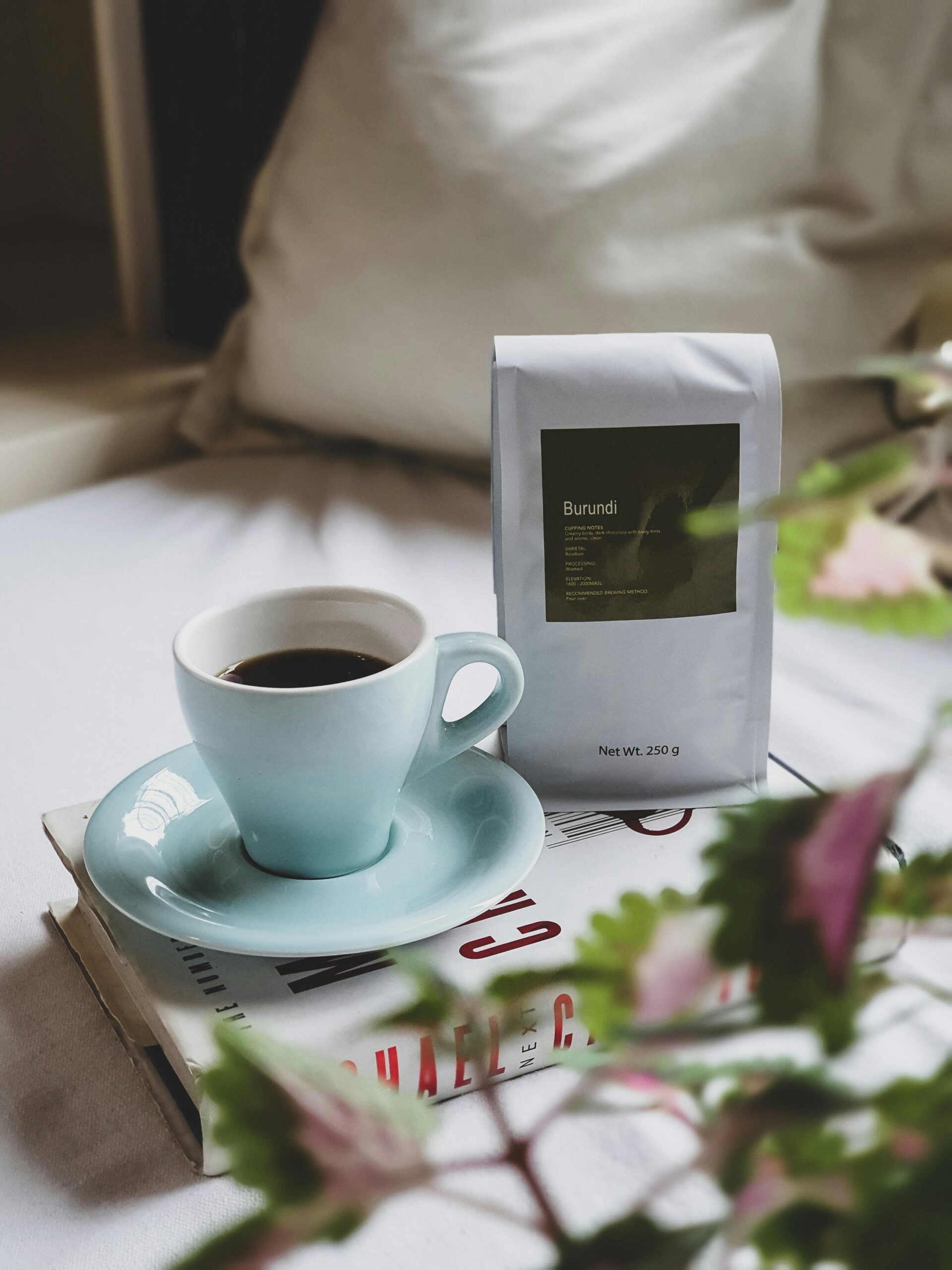 A comforting scene with a cup of coffee and Burundi coffee beans at home.